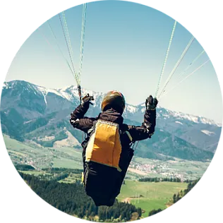 paragliding over a volcano or waterfall paragliding over a volcano or waterfall