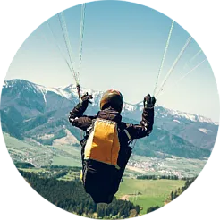 paragliding over a volcano or waterfall paragliding over a volcano or waterfall